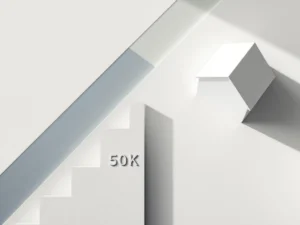 Architectuurmodel van wit huis met betonnen blokken die financiële groei tonen, inclusief 50K markering